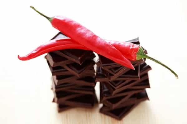 stack of dark chocolate with chilli pepper - sweet food